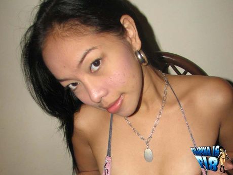 Asian teen with tiny tits and a hairy cunt strips and unveils her body